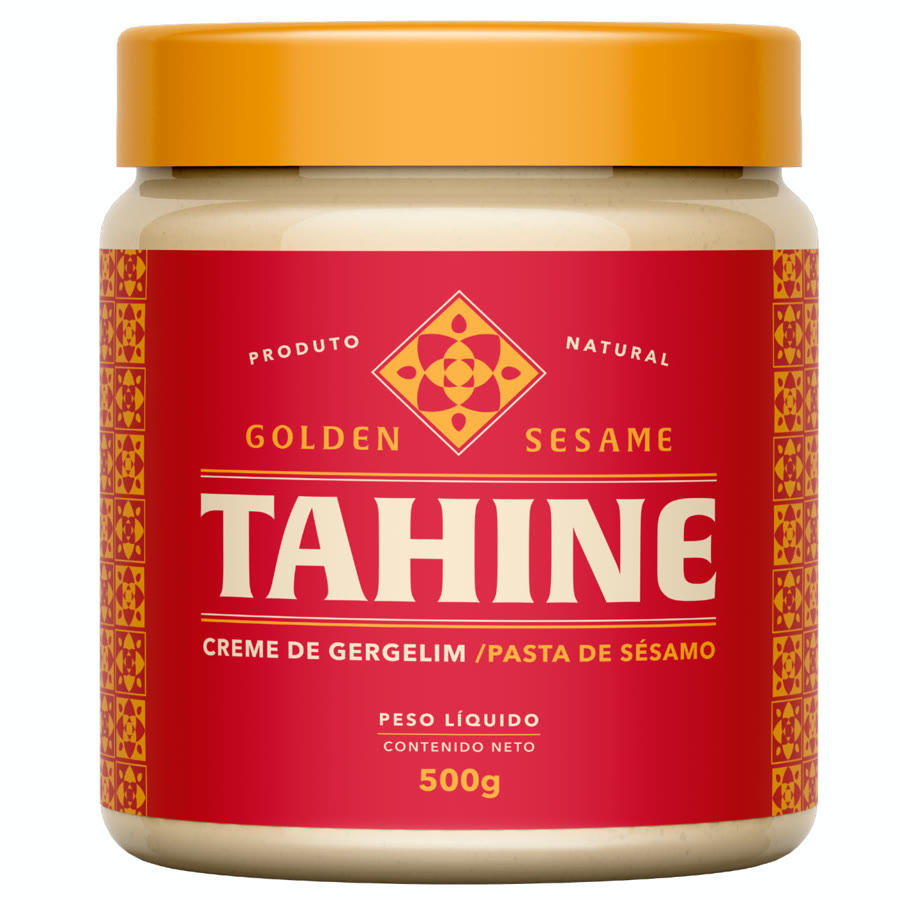 Nova embalagem do tahine Golden Sesame: pote com tampa dourada, rótulo vermelho com losango geométrico e a palavra Tahine em destaque.